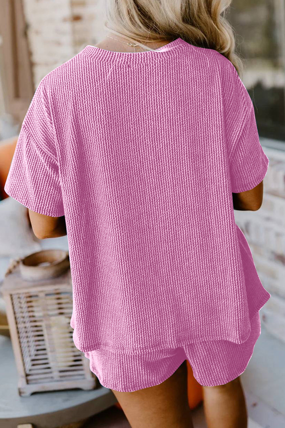 Pink waffle knit lounge set with short sleeves and a relaxed fit.