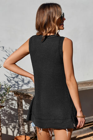 Black waffle knit tank top with asymmetric hem and raw edge detail