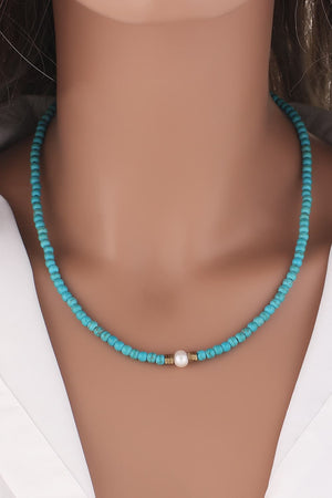 Turquoise bead necklace with pearl and gold accents