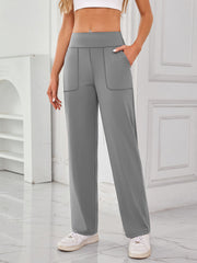 Gray wide-leg lounge trousers with patch pockets and contrast stitching.