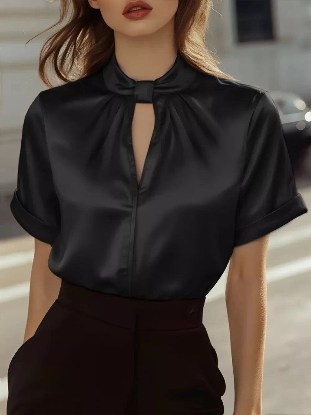Black satin blouse with twisted keyhole neckline and short sleeves
