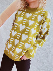Mustard acrylic knit jumper with all-over white geometric heart pattern and mock neck.