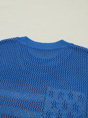 Blue acrylic knit crew neck t-shirt with open mesh pattern showing red underneath.
