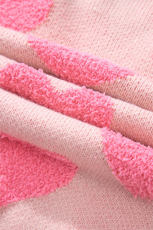 Blush pink knit sweater with textured heart motif detail