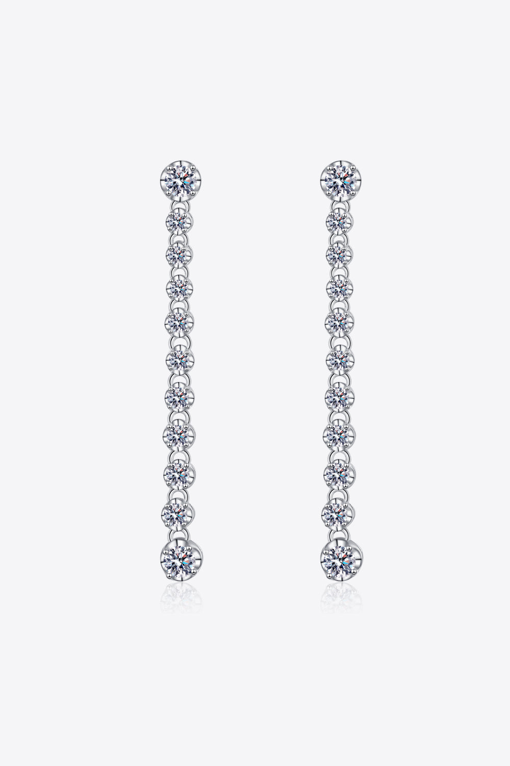 Silver linear drop earrings with multiple moissanite stones cascading down.