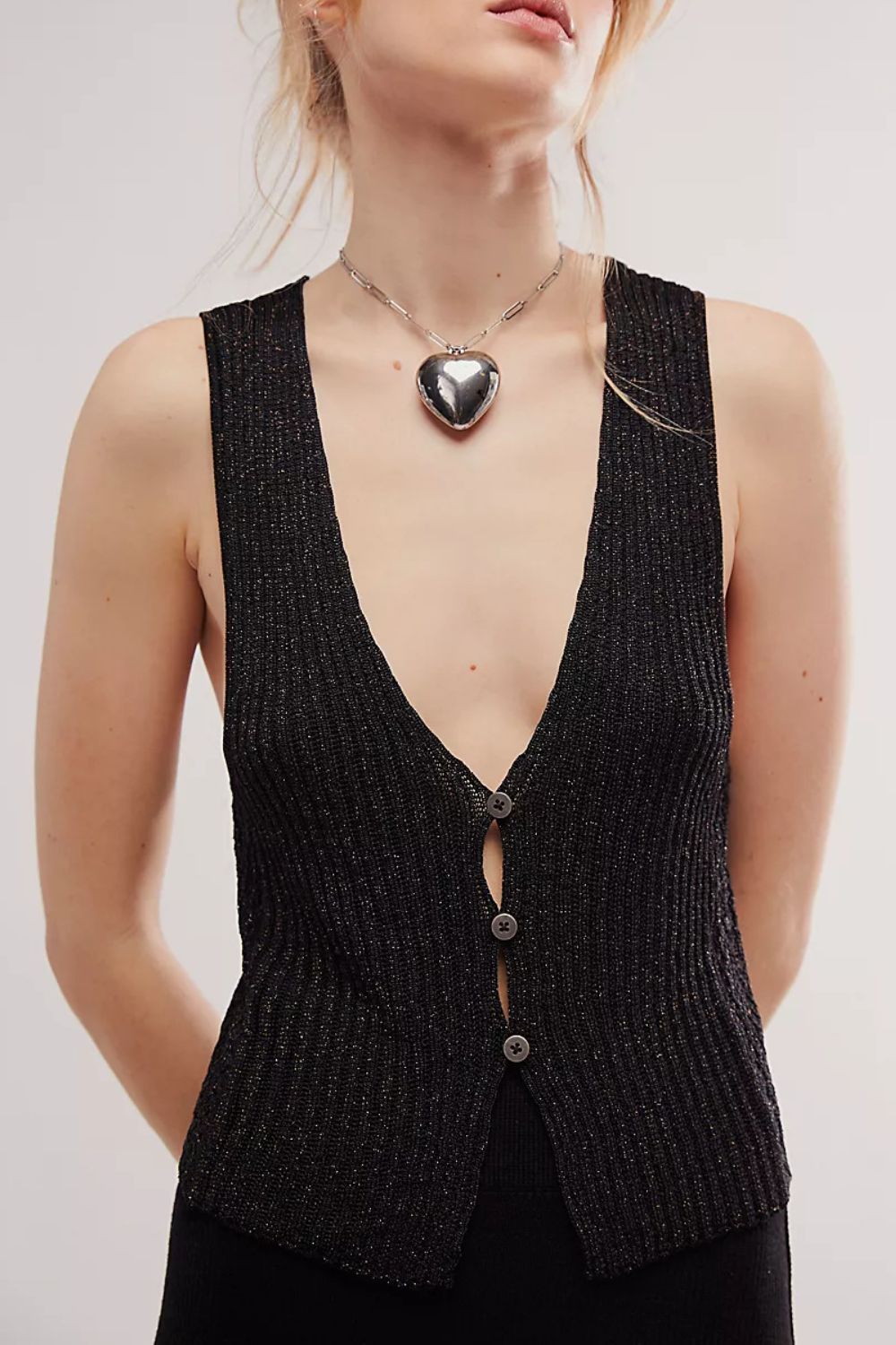 Black ribbed button-down vest with a deep V-neck and subtle sparkle detail.