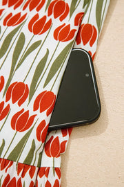 Cotton mini dress with red tulip print and side pocket detail.