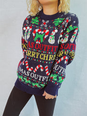 Dark blue graphic knit Christmas sweater with snowmen, candy canes, and trees.