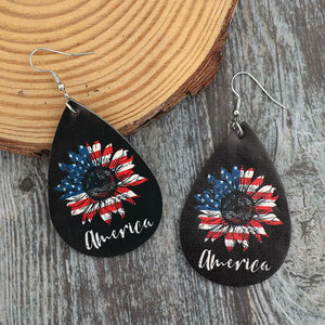 Black teardrop earrings with American flag sunflower design and "America" text.