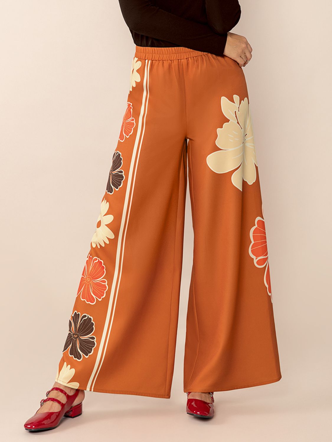 Seventies floral palazzo trousers in tangerine with wide legs and side stripe detail.