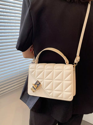 Diamond quilted pu leather crossbody bag in beige white with gold hardware and clasp.