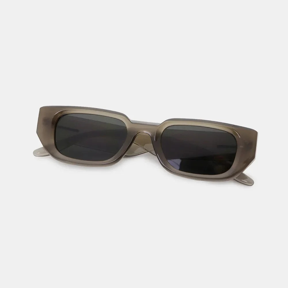 Smoked acetate angular sunglasses in taupe with dark lenses.