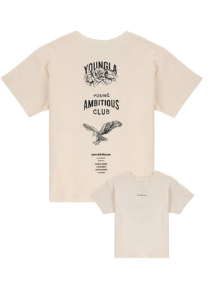 Beige raw edge graphic tee with "Young Ambitious Club" text and eagle graphic.