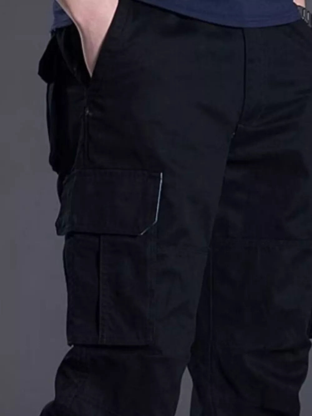 Men's black relaxed fit cargo pants with multiple pockets and white stitching detail.