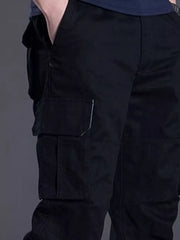 Men's black relaxed fit cargo pants with multiple pockets and white stitching detail.