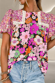 Floral patchwork puff sleeve blouse with lace trim and a mixed floral and abstract print.