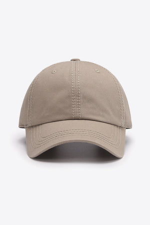Beige canvas baseball cap with stitched details and curved brim