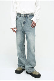 Baggy denim jeans in medium wash with subtle fade and relaxed fit.