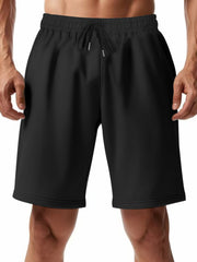 Black chino shorts with drawstring waist and pockets for men.