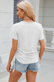 White perforated tee with gathered sides and drawstring detail
