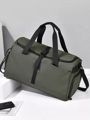 Green Oxford cloth travel bag with black straps and buckle detail.