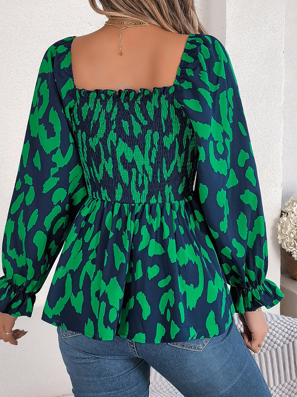 Dark green and navy abstract print smocked bodice square neck blouse with ruffled cuffs