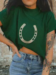 Green ribbed knit sweater with a large horseshoe graphic and short sleeves.