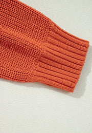 Orange acrylic knit sweater sleeve with ribbed cuff detail