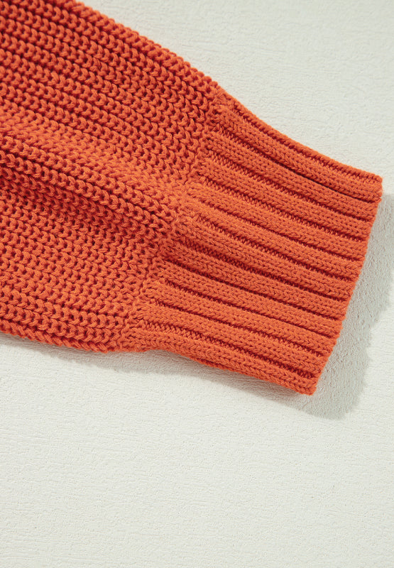 Orange acrylic knit sweater sleeve with ribbed cuff detail