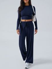 Dark blue ribbed knit crop top and wide leg pants set with drawstring waist.