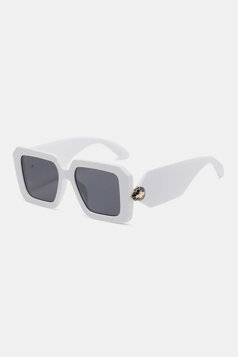 White geometric facet sunglasses with dark lenses and a jeweled embellishment on the arm.