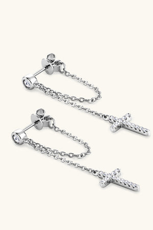 Silver dangling cross chain stud earrings with cubic zirconia.