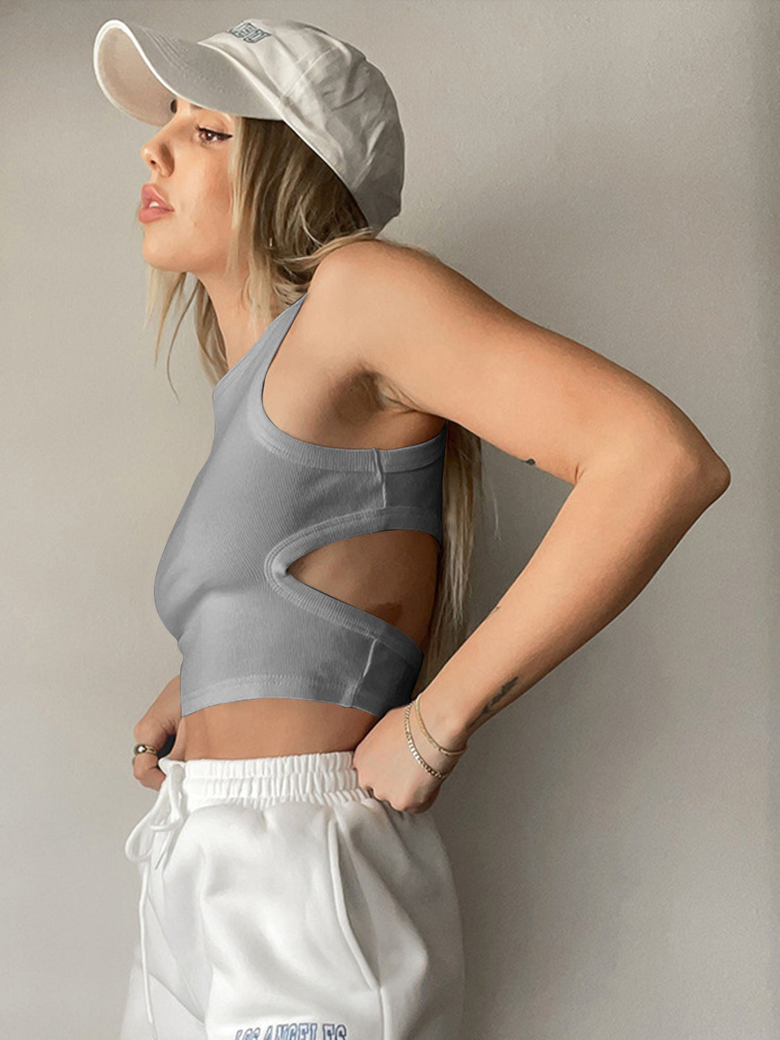 Gray ribbed crop top with side cutouts and a scoop neck.