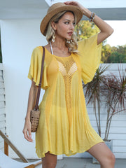 Yellow crochet inset beach cover-up dress with short flutter sleeves and A-line cut.