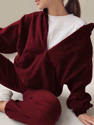Burgundy fleece zip-up hoodie and jogger set with a white t-shirt.