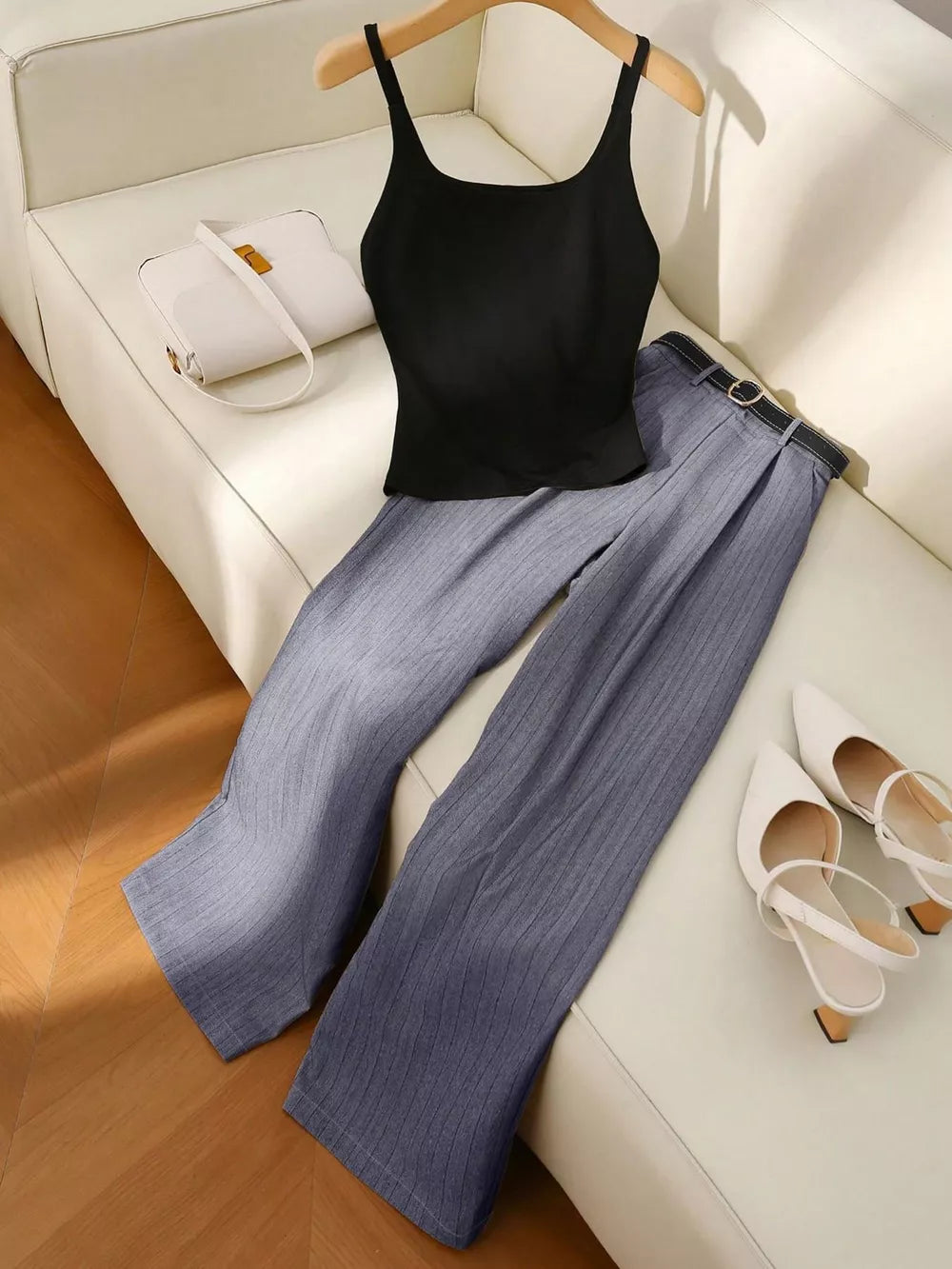 Chic sleeveless top and wide-leg pants set in gray pinstripe with black belt.