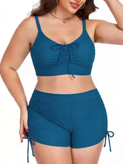 Plus size Peacock Blue adjustable drawstring swimwear set with ruched front bikini top and tie-side shorts.