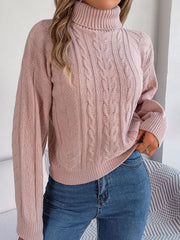 Dusty Pink cable knit turtleneck sweater with drop shoulder and textured pattern.