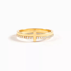 Gold-plated ring with a delicate cross and pave crystal band.