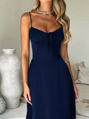 Navy tie-front maxi dress with spaghetti straps and sweetheart neckline.
