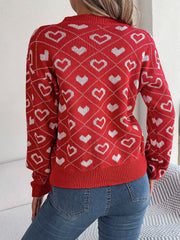 Deep Red acrylic V-neck sweater with allover white heart jacquard pattern and ribbed trim.
