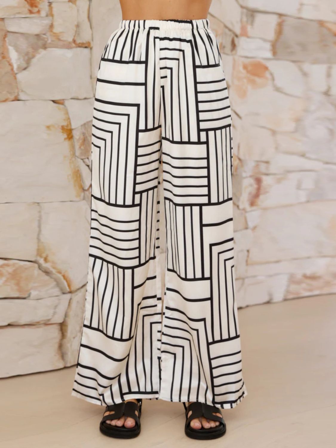White geometric print wide leg pants with elastic waistband.