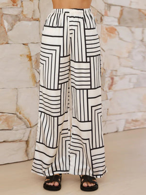 White geometric print wide leg pants with elastic waistband.