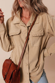 Tan corduroy utility shirt with ruffled chest pockets and button front.