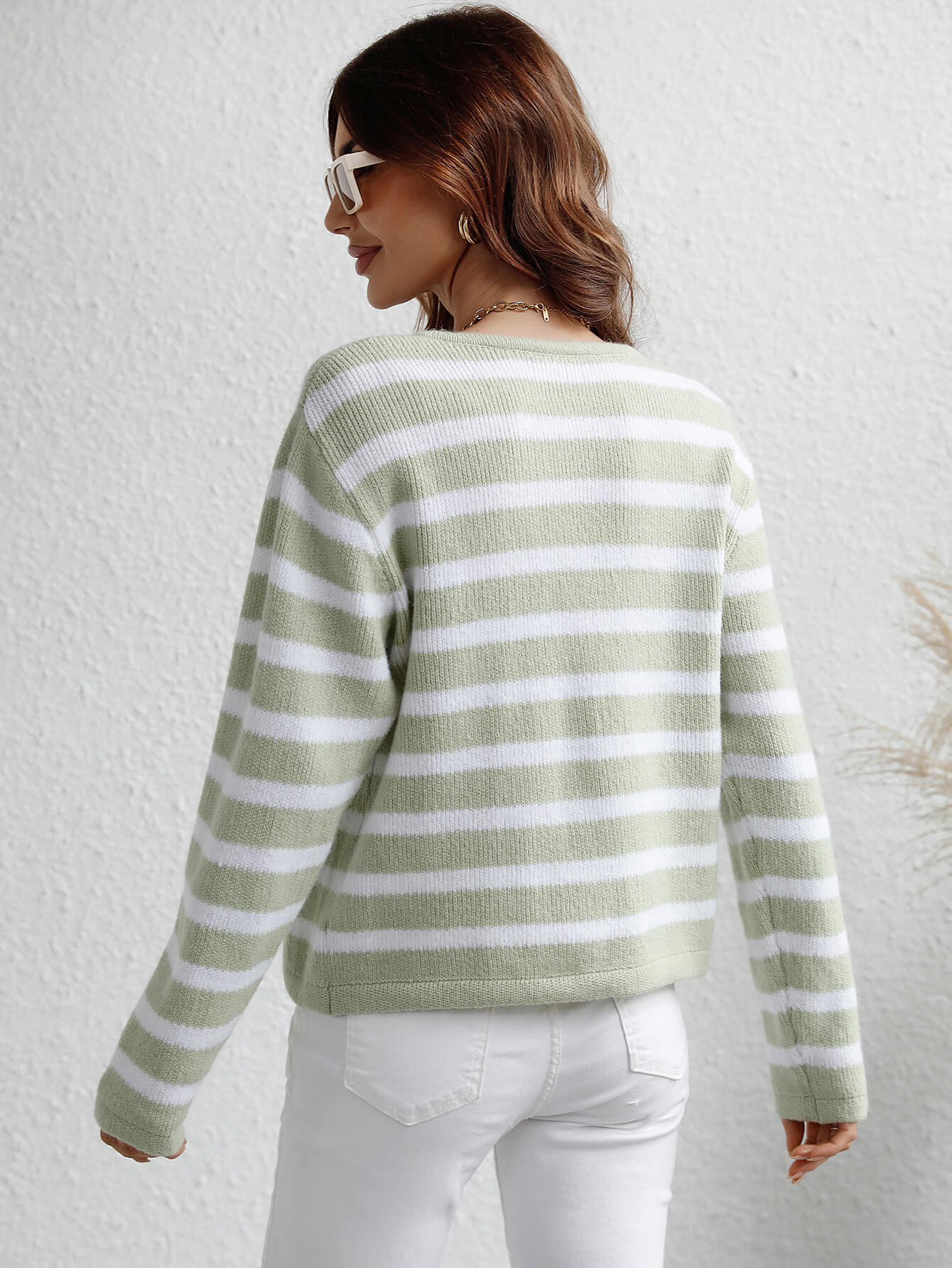 Mint and white horizontal stripe knit cardigan with pockets.