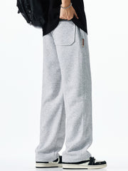Men's light grey casual drawstring sweatpants with loose fit and back pocket detail.