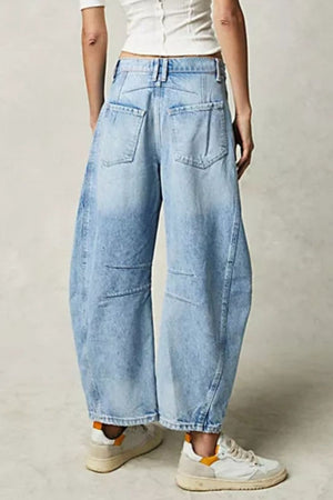 Light blue denim barrel leg jeans with a relaxed fit and pocket details.
