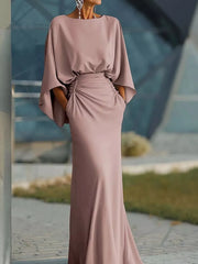 Sophisticated batwing sleeve maxi dress in pink with ruched waist and pockets.