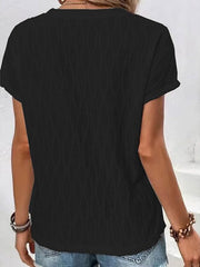 Black textured tee with short sleeves and a knot-front detail.