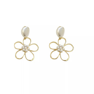 Gold floral drop earrings with pearl accents and a pearl top.